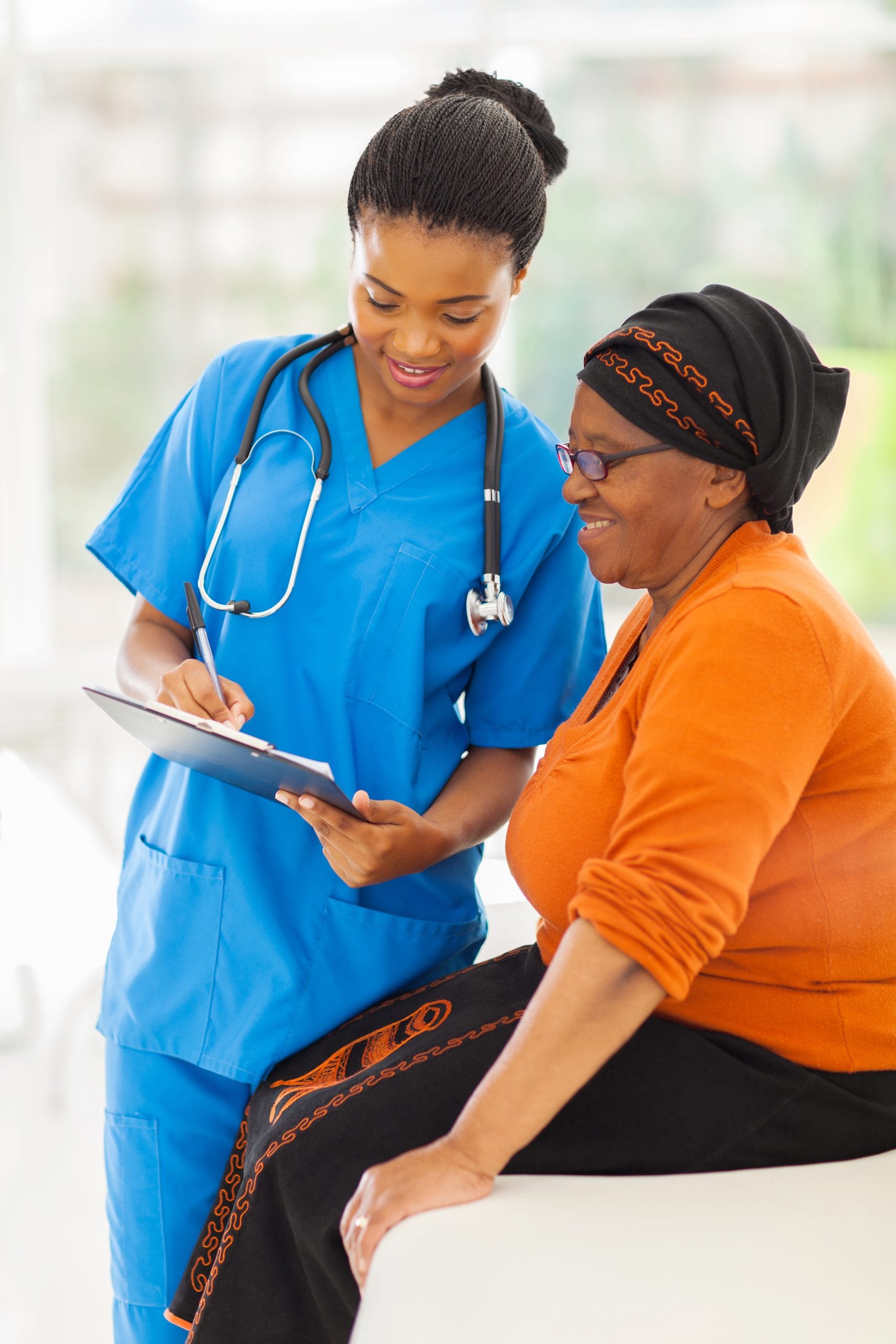 Healthcare provider and patient reviewing information.